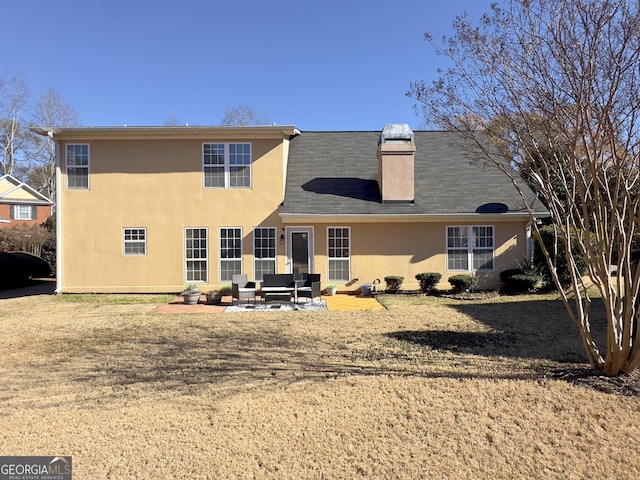 back of house with outdoor lounge area and a patio area