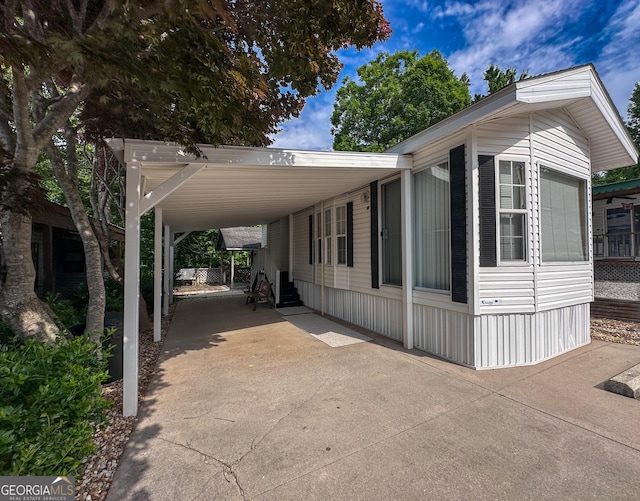 view of side of property with a carport