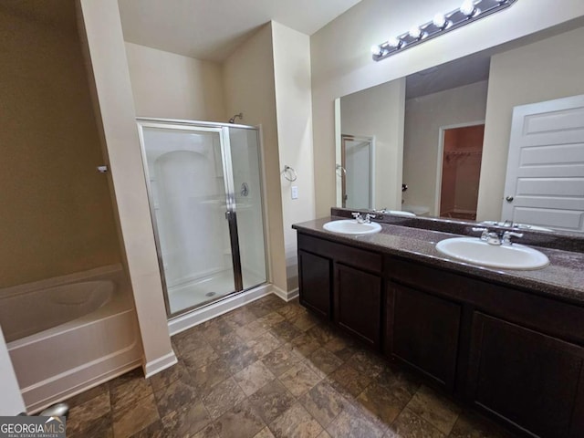 bathroom featuring vanity and shower with separate bathtub