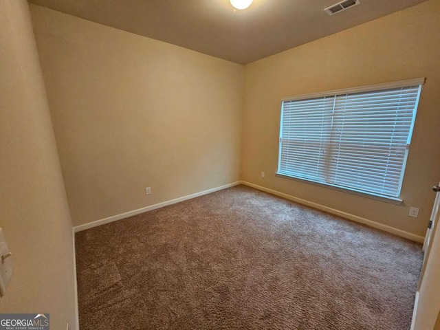 view of carpeted spare room