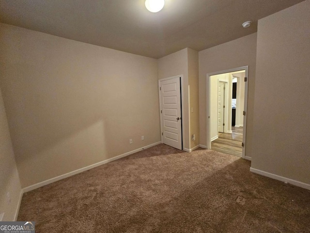 unfurnished bedroom with carpet flooring