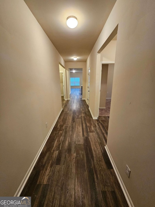 hallway featuring dark wood-type flooring