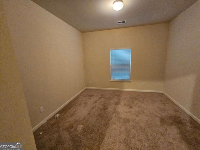 empty room featuring carpet floors