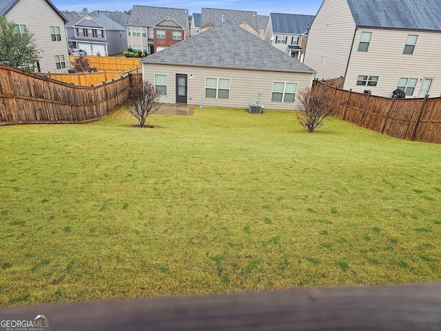 rear view of house with a yard