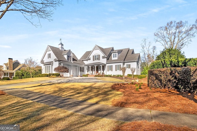 cape cod-style house with a garage