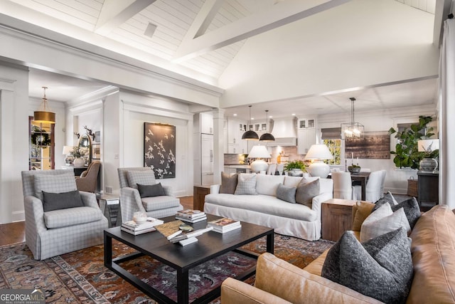 living room featuring high vaulted ceiling, beamed ceiling, dark hardwood / wood-style flooring, and a chandelier