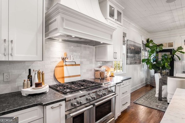 kitchen featuring premium range hood, range with two ovens, white cabinets, and dark hardwood / wood-style floors