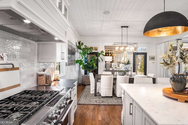 kitchen with high end range, custom exhaust hood, wood ceiling, white cabinets, and dark hardwood / wood-style flooring