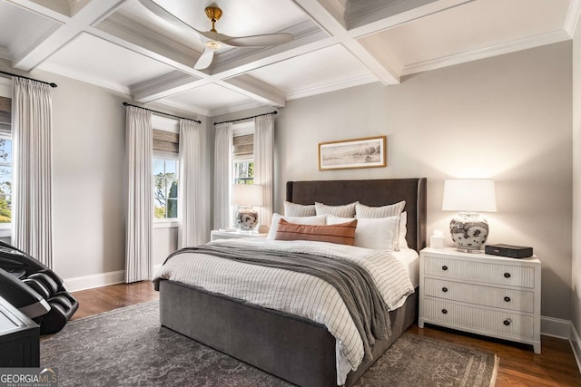 bedroom with ceiling fan, dark hardwood / wood-style floors, beam ceiling, coffered ceiling, and ornamental molding