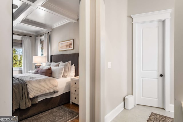 bedroom featuring crown molding, coffered ceiling, and beamed ceiling