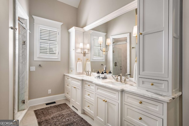 bathroom featuring vanity, tile patterned floors, and walk in shower