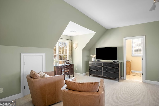 living room featuring ceiling fan, light carpet, lofted ceiling, and a healthy amount of sunlight