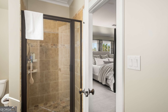 bathroom featuring toilet and walk in shower