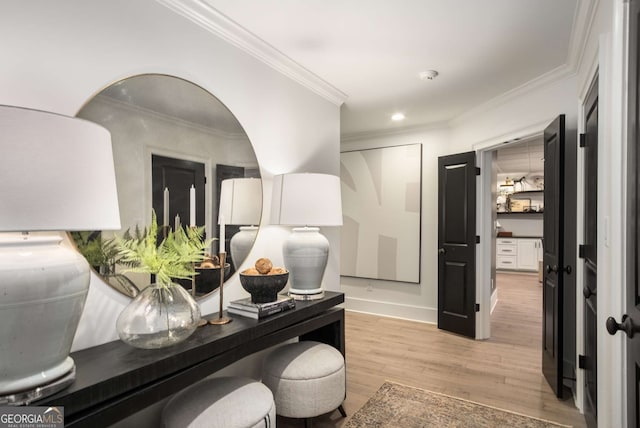 home office featuring ornamental molding and light hardwood / wood-style flooring