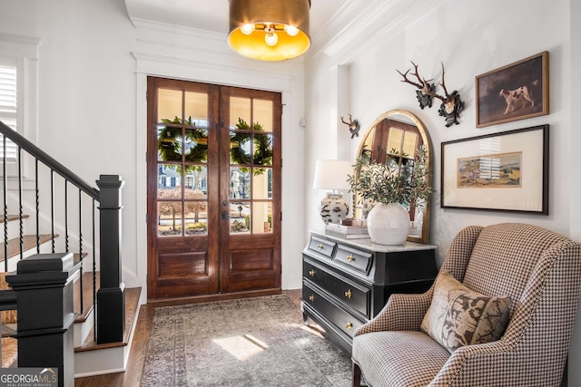 foyer featuring dark wood-type flooring and french doors