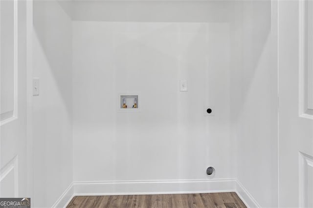 washroom with hardwood / wood-style floors, washer hookup, and hookup for an electric dryer