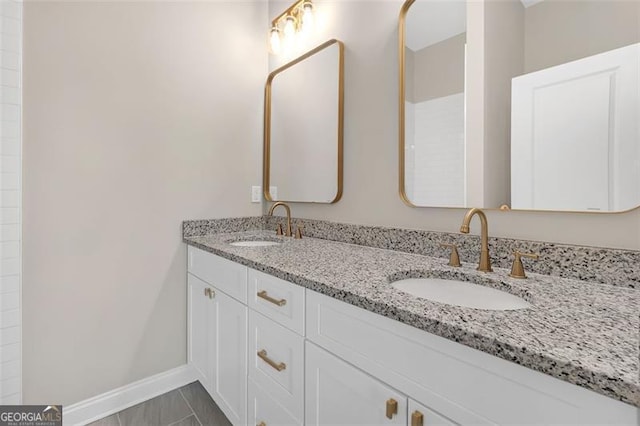 bathroom with tile patterned floors and vanity