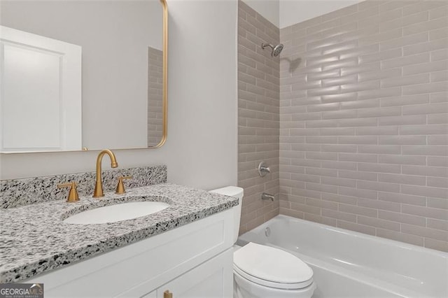 full bathroom featuring vanity, toilet, and tiled shower / bath