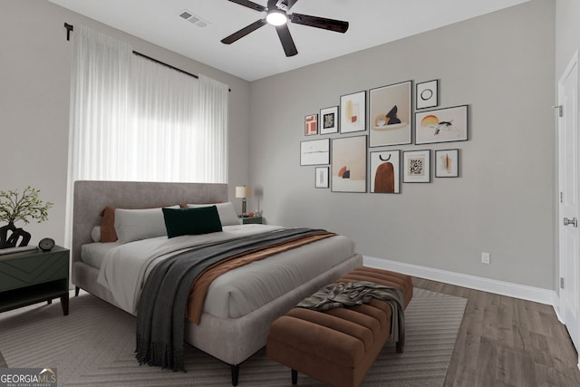 bedroom featuring ceiling fan and wood-type flooring