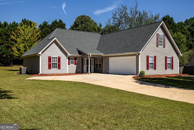 view of front of property with cooling unit, a garage, and a front lawn