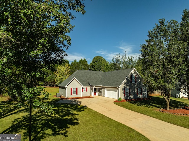 view of front of home featuring a garage and a front lawn