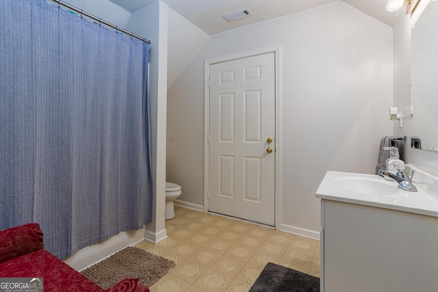 full bathroom with shower / tub combo, vanity, vaulted ceiling, and toilet