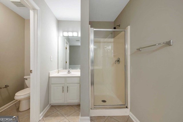 bathroom with toilet, vanity, tile patterned floors, and an enclosed shower