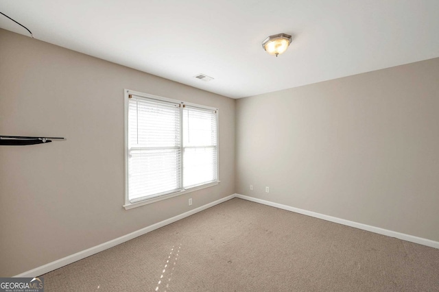 empty room with carpet flooring