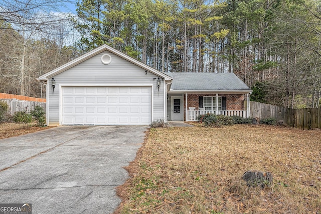 ranch-style home with covered porch and a garage