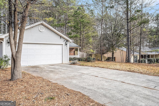 view of side of home featuring a garage