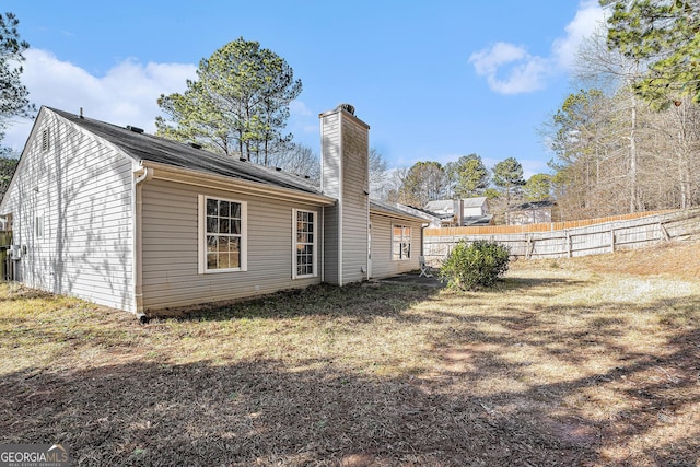 view of property exterior with a yard