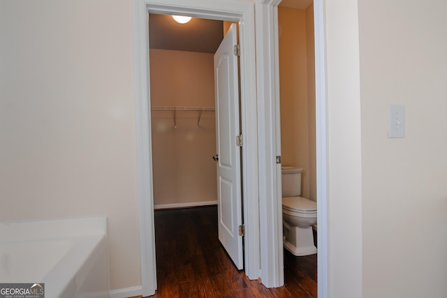 hallway featuring dark hardwood / wood-style floors