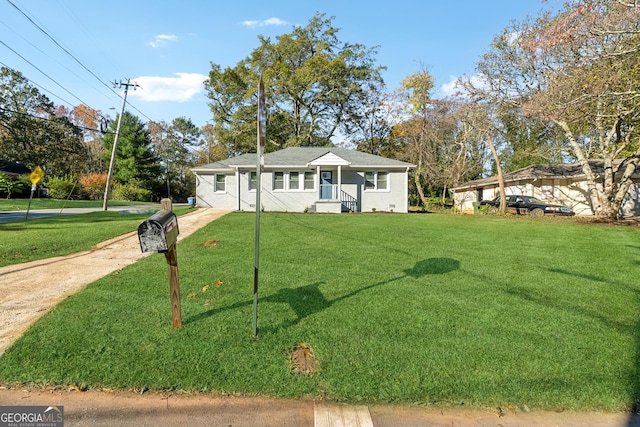 ranch-style home featuring a front yard