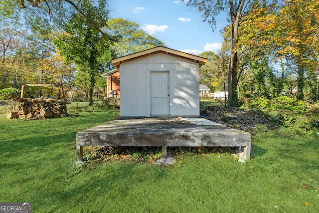 view of outdoor structure with a lawn