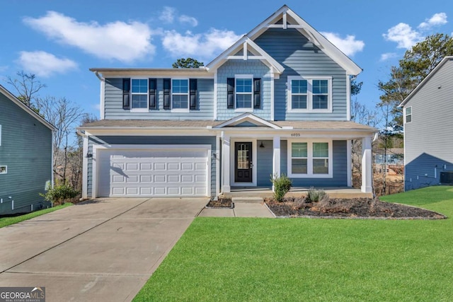 view of front facade with a front yard, central AC, and a garage