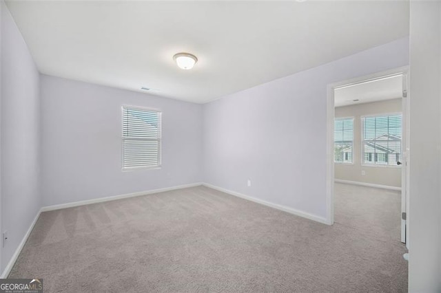 empty room with light colored carpet