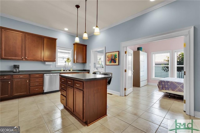 kitchen with sink, stainless steel dishwasher, decorative light fixtures, a kitchen island, and ornamental molding