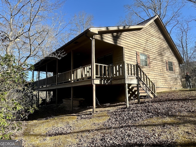 view of side of home featuring a wooden deck