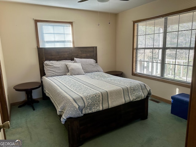 bedroom with ceiling fan and carpet floors