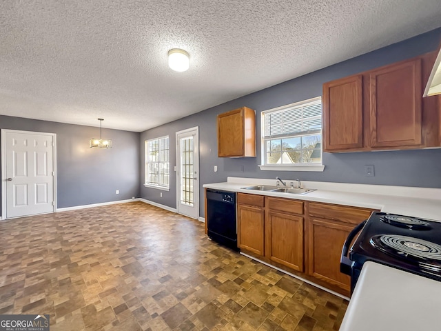 kitchen featuring sink, a chandelier, a wealth of natural light, pendant lighting, and black appliances