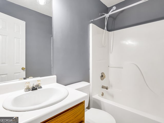 full bathroom with vanity, tub / shower combination, and toilet