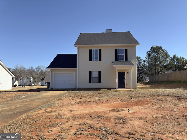 view of front of property with a garage