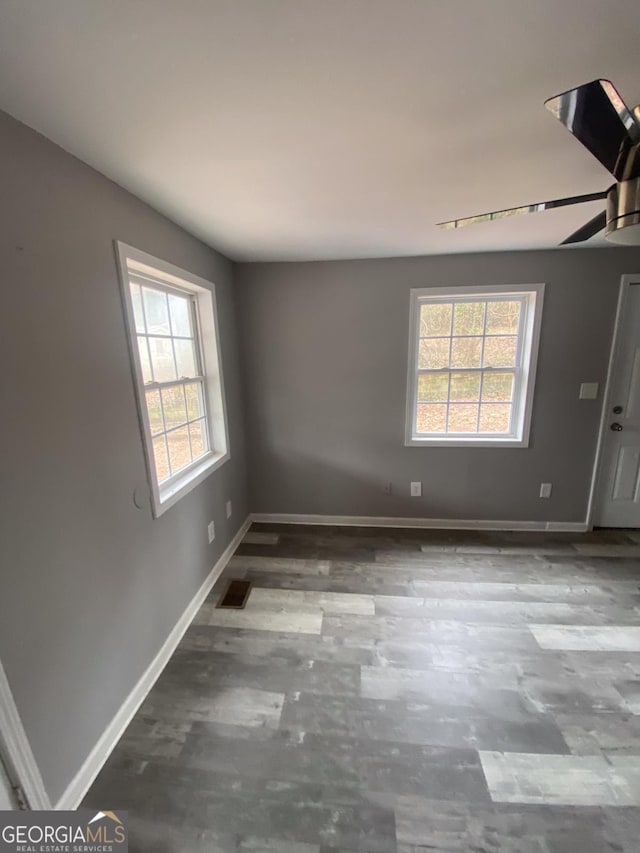 unfurnished room with ceiling fan