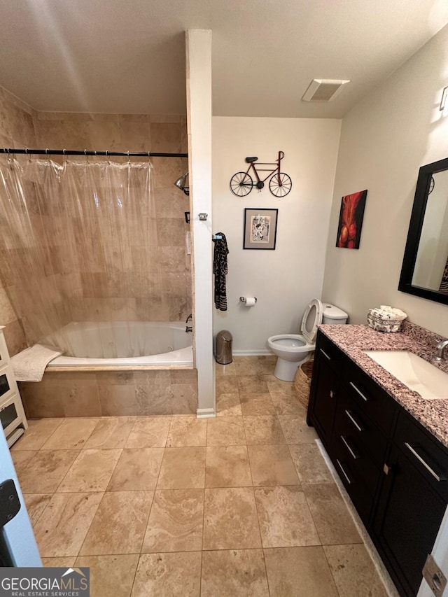 full bathroom with shower / tub combo, vanity, and toilet