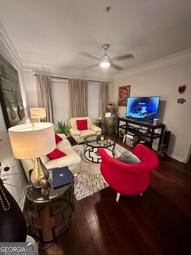 living room with crown molding, ceiling fan, and hardwood / wood-style flooring