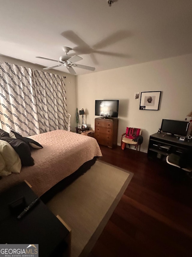 bedroom with hardwood / wood-style flooring and ceiling fan