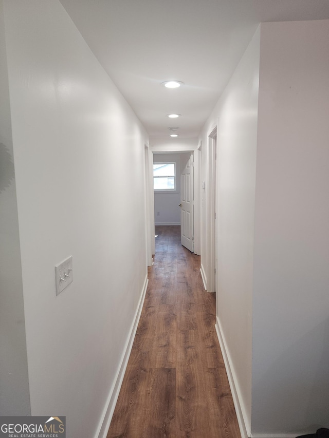 hall featuring dark wood-type flooring