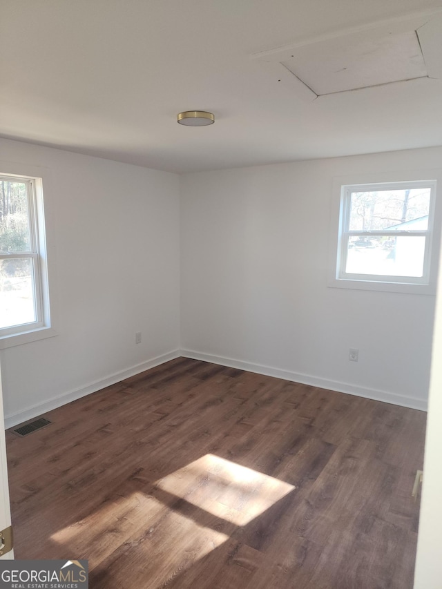 unfurnished room featuring dark hardwood / wood-style floors