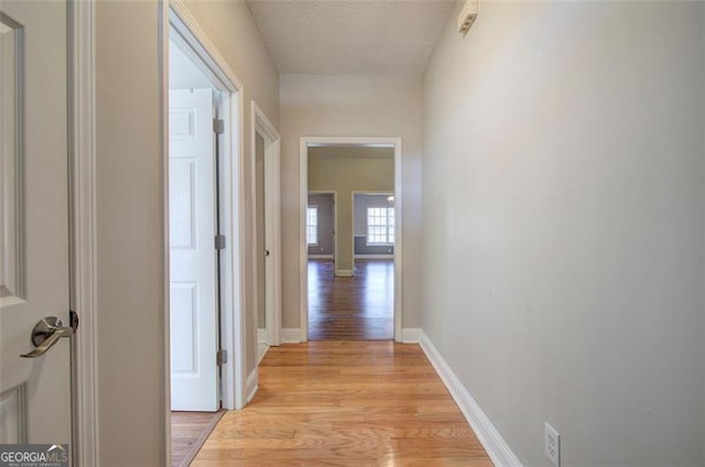 hallway with light wood-type flooring