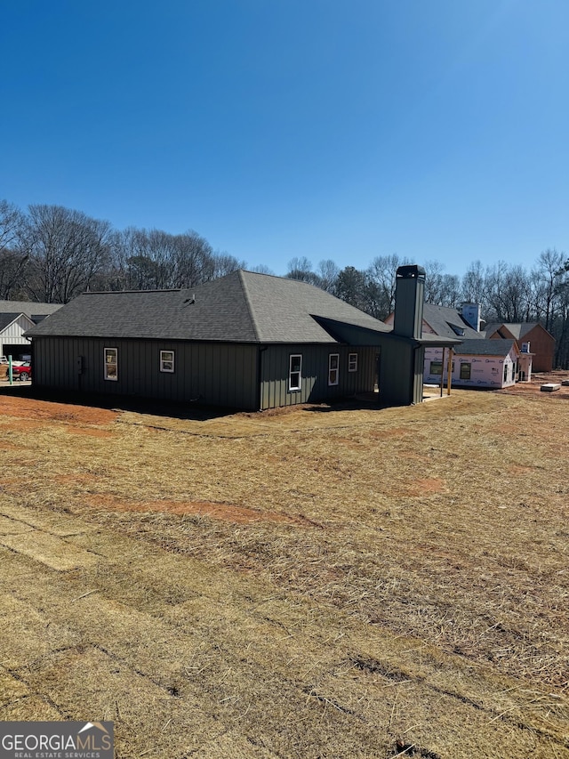 view of property exterior featuring a chimney